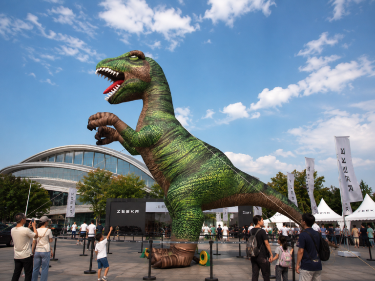 Giant inflatable T-Rex displayed at an outdoor family event