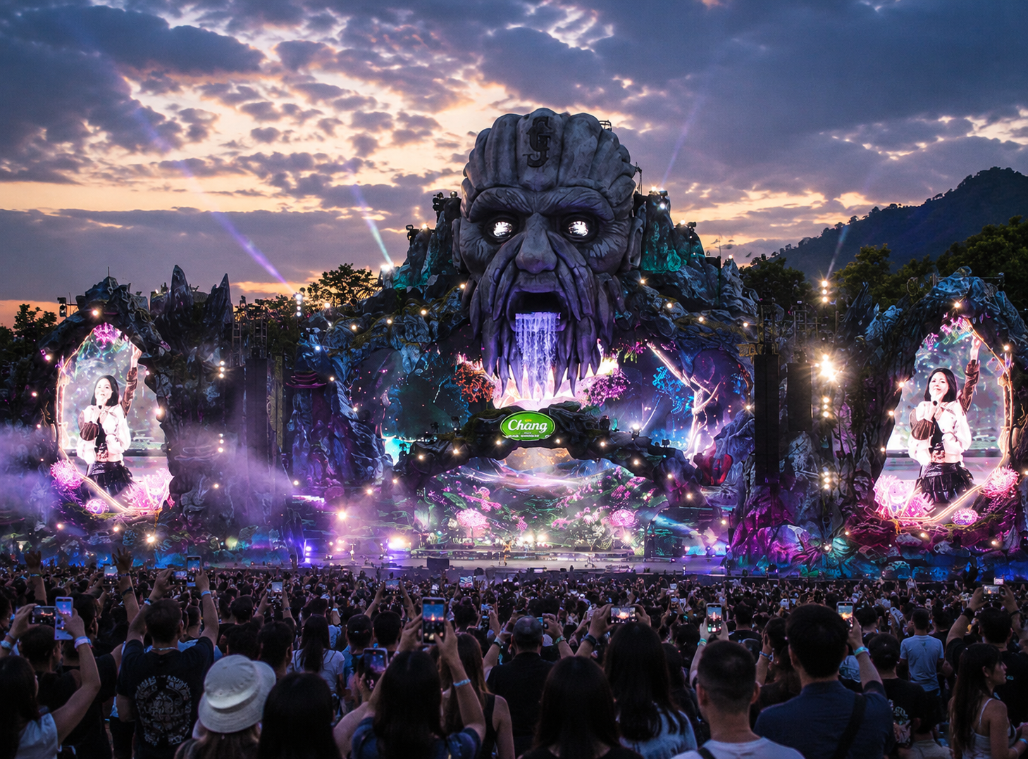 Giant inflatable fantasy face integrated into a large outdoor music festival stage