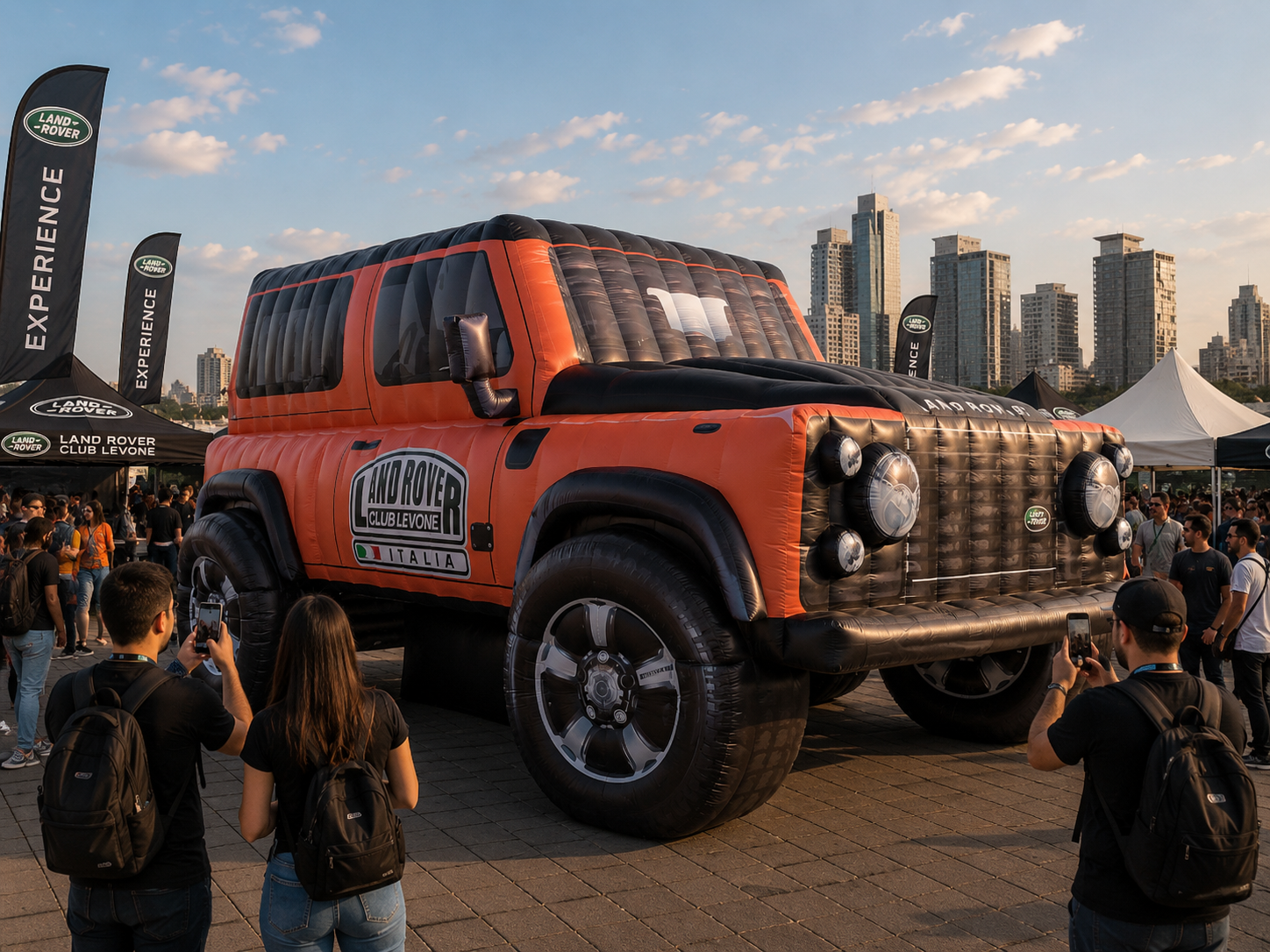 Inflatable off-road vehicle replica displayed at an outdoor automotive event