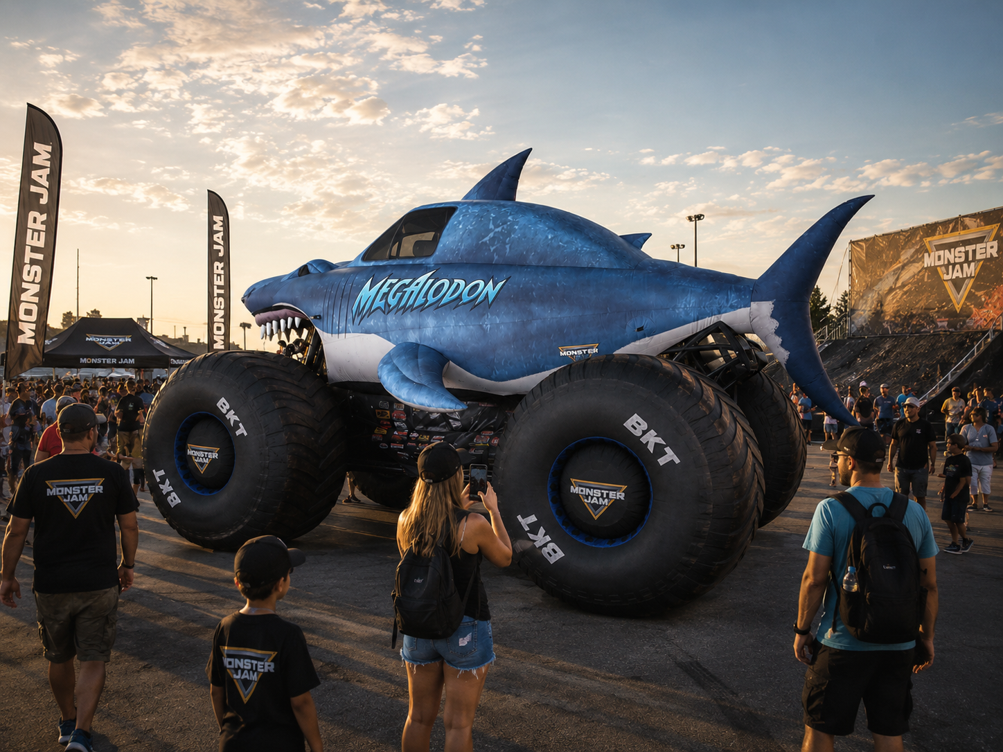 Giant inflatable shark monster truck displayed at an outdoor motorsports event