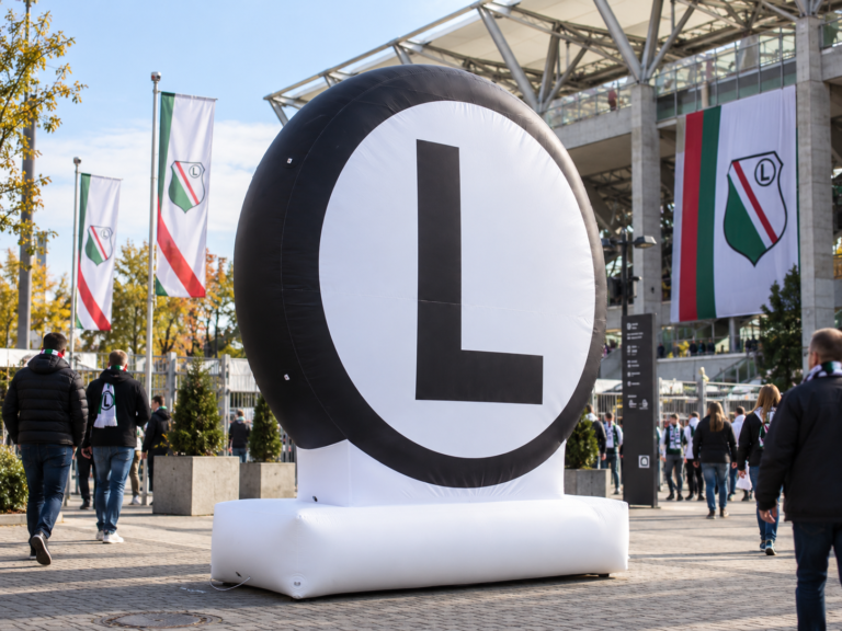 Large inflatable Legia Warszawa “L” symbol displayed outside the stadium during a football event