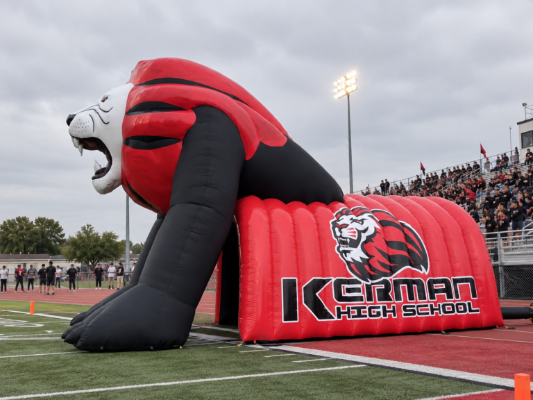 Giant inflatable lion mascot tunnel designed for Kerman High School sports team entrances