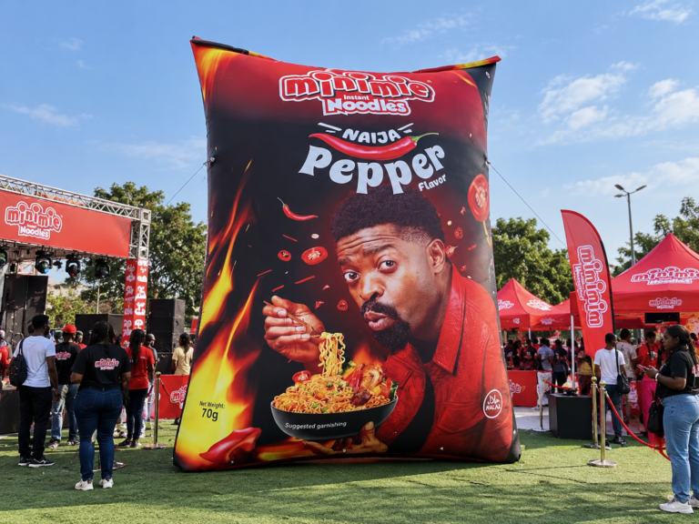 Giant inflatable Minimie chinchin snack pack displayed during an outdoor brand activation