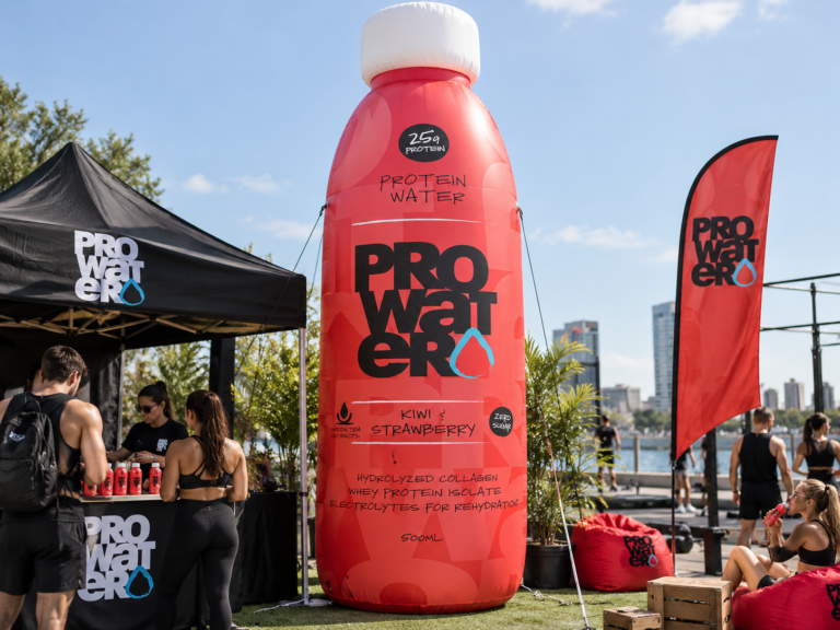 Large inflatable ProWater bottle displayed as a branded promotional element for product launches and outdoor activations