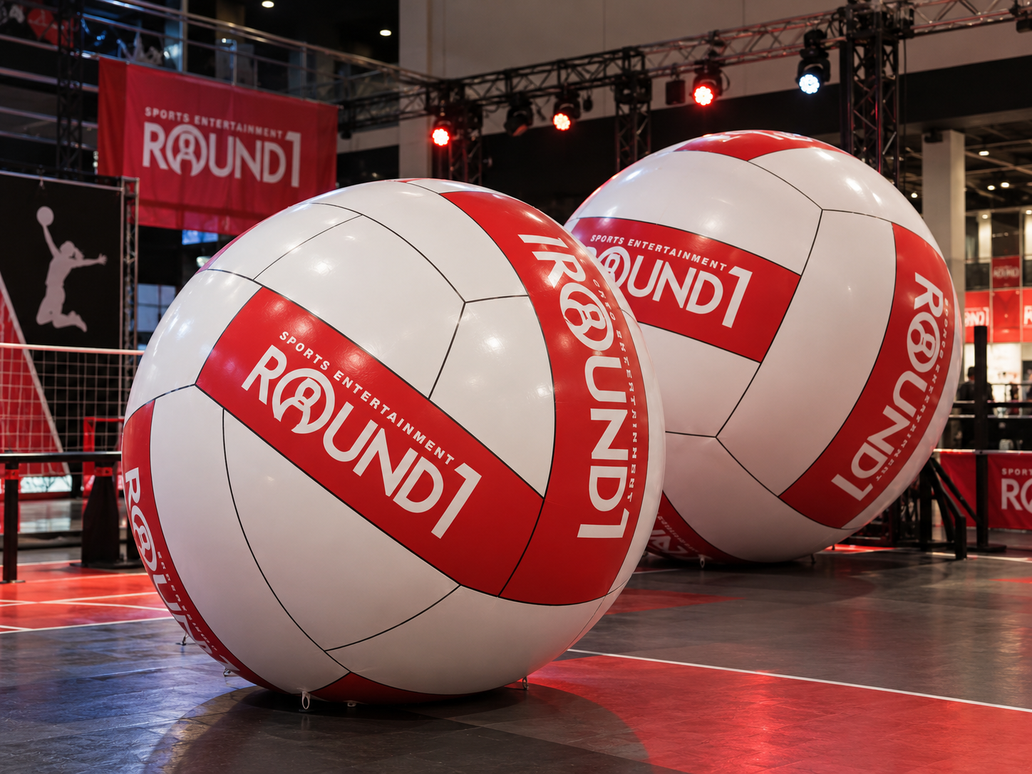Giant inflatable ROUND1 volleyballs displayed at a sports entertainment event