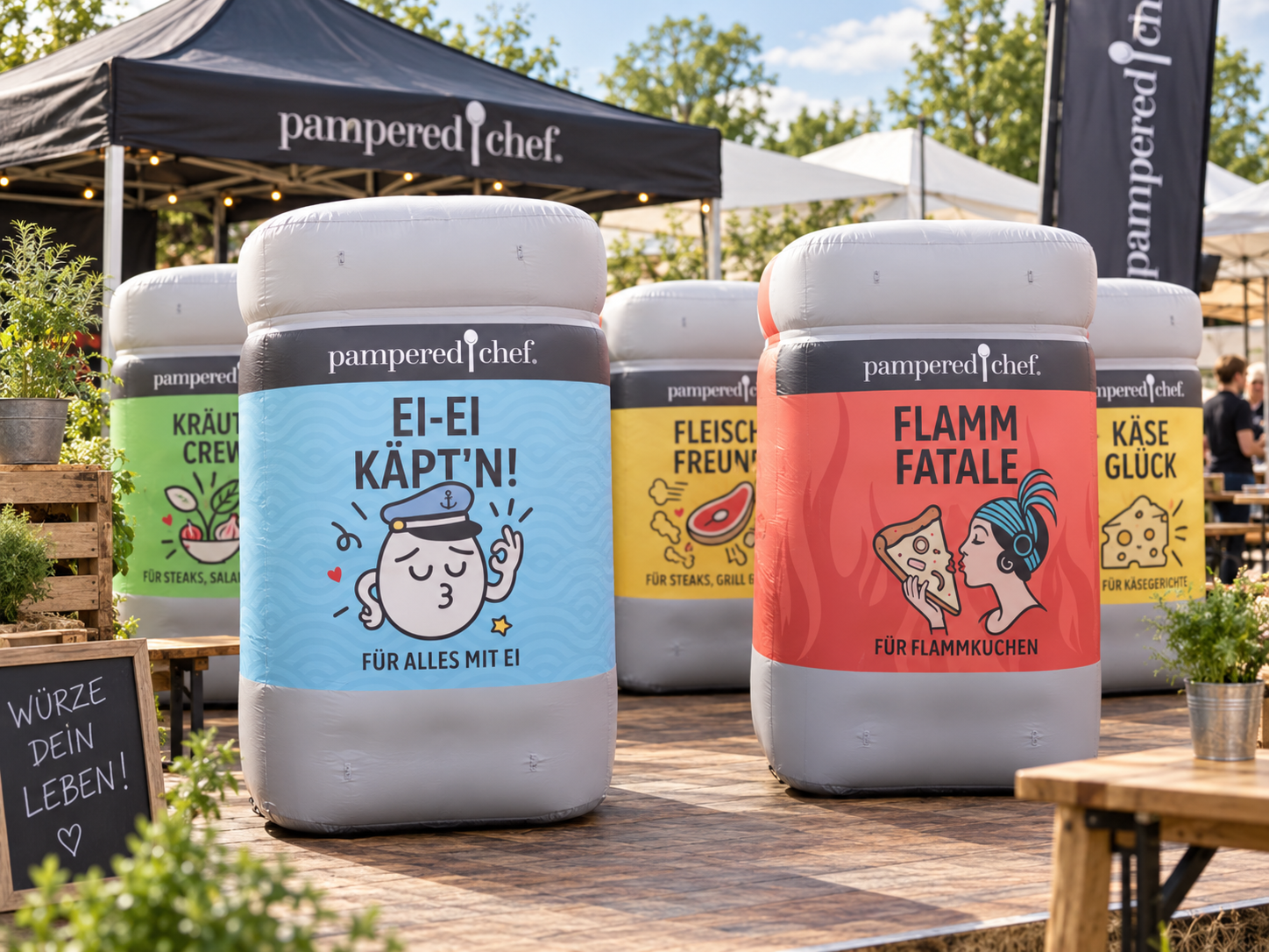 Large inflatable Pampered Chef spice jars displayed during a branded promotional event